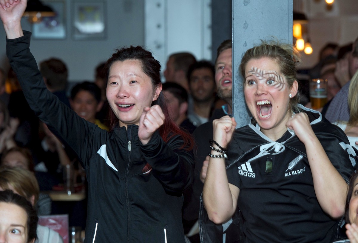New Zealand All Blacks rugby fan Michaela Brehlova (R) reacts their Rugby World Cup win against Australia's Wallabies at a bar in Auckland, New Zealand, November 1, 2015. REUTERS/Chris Cameron ED ...