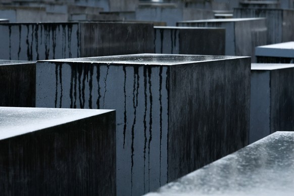 epa11855898 Rainwater runs down on the stelae at the Memorial to the Murdered Jews of Europe, in Berlin, Germany, 27 January 2025. January 27 marks International Holocaust Remembrance Day, observed wo ...