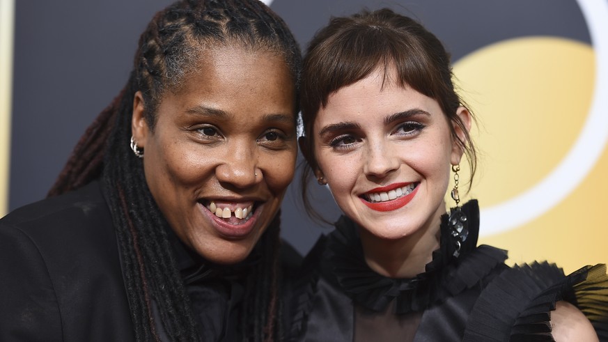 Marai Larasi, left, and Emma Watson arrive at the 75th annual Golden Globe Awards at the Beverly Hilton Hotel on Sunday, Jan. 7, 2018, in Beverly Hills, Calif. (Photo by Jordan Strauss/Invision/AP)