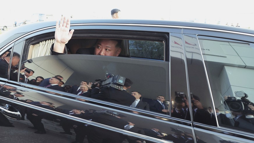 In this North Korean government photo, North Korean leader Kim Jong Un reacts as Russian President Vladimir Putin sends him away from the Vostochny cosmodrome outside the city of Tsio...