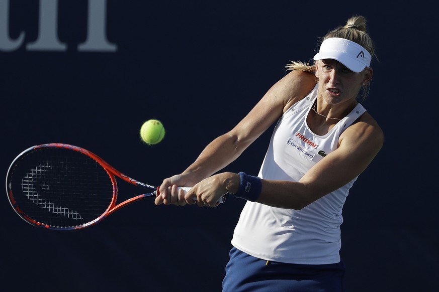 Jil Teichmann, of Switzerland, returns a shot to Kaia Kanepi, of Estonia, during the U.S. Open tennis tournament Wednesday, Aug. 29, 2018, in New York. (AP Photo/Jason DeCrow)