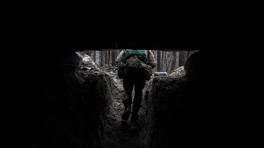 January 15, 2023, Donbas, Ukraine: A soldier leaves the trench on the northern front of Donbas The military movement in the northern part of the Donbas is constant.  At the moment, the line of defense is…