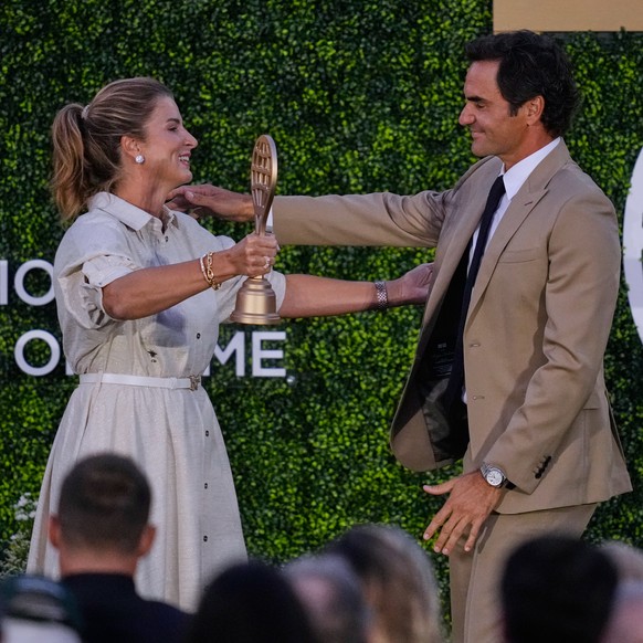 Roger Federer embraces his wife Mirka during his induction ceremony at the International Tennis Hall of Fame, Saturday, Aug. 29, 2026, in Newport, R.I. (AP Photo/Charles Krupa)
Roger Federer