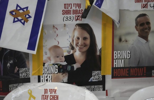 A poster shows Shiri Bibas, who was kidnapped to Gaza with her husband and two young sons on Oct. 7, 2023, in Jerusalem, Friday, Feb. 21, 2025. (AP Photo/Mahmoud Illean)