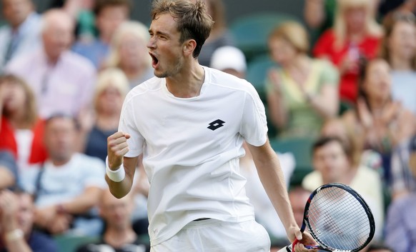 Russia&#039;s Daniil Medvedev celebrates after winning the third set of his Men&#039;s Singles Match against Switzerland&#039;s Stan Wawrinka, on the opening day at the Wimbledon Tennis Championships  ...