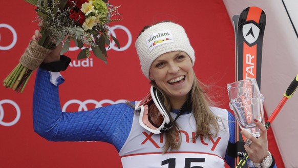 Manuela Moelgg, of Italy, celebrates on the podium after finishing third place in the women's FIS Alpine Skiing World Cup giant slalom race, Saturday, Nov. 25, 2017, in Killington, Vt. (AP Photo/ ...