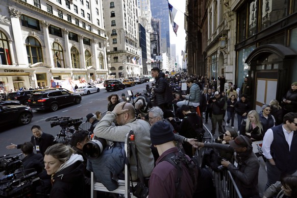 epa10557527 The media lines up waiting for former US president Donald J. Trump to arrive at Trump Tower in New York, New York, USA, 03 April 2023. After being indicted by a Manhattan grand jury last w ...