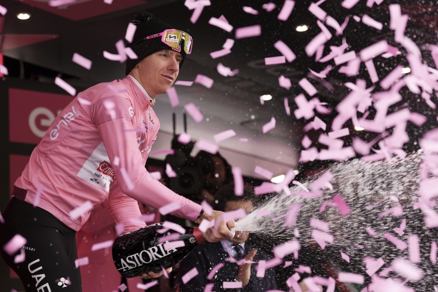 Tadej Pogacar celebrates retaining the pink jersey of leader of the race after the 17th stage of the Giro d&#039;Italia from Selva di Val Gardena to Passo Brocon, Italy, Wednesday, May 22, 2024. (Marc ...