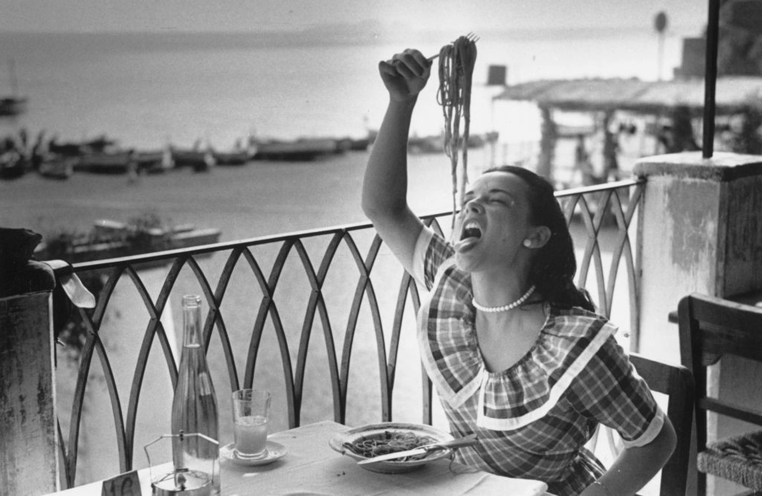 September 1949: 18-year old London student Mercy Haystead enjoys a plate of spaghetti, whilst on holiday in Italy as an official guest of the town of Positano. Original Publication: Picture Post - 488 ...