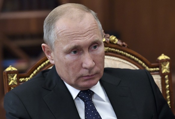 Russian President Vladimir Putin, listens during a meeting in the Kremlin in Moscow, Russia, Wednesday, Nov. 7, 2018. The Kremlin said Wednesday that Russia and the U.S. have agreed not to hold a full ...