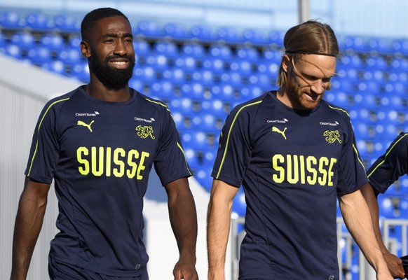 From left, Switzerland&#039;s defender Johan Djourou, Switzerland&#039;s defender Michael Lang and Switzerland&#039;s defender Jacques Francois Moubandje arrive for a training session of the Switzerla ...