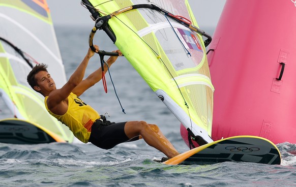 epa09367264 Mateo Sanz Lanz of Switzerland competes in the Men&#039;s RS:X Windsurfing discipline in the Sailing events of the Tokyo 2020 Olympic Games in Enoshima, Japan, 26 July 2021. EPA/CJ GUNTHER