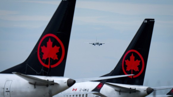 FILE - Air Canada aircraft sit parked at Vancouver International Airport in Richmond, British Columbia, Aug. 18, 2025. (Darryl Dyck/The Canadian Press via AP, file)
Canada Air Canada Flight Attendants