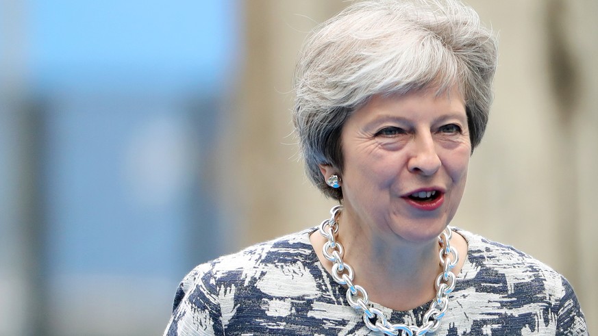 epa06882600 Britain&#039;s Prime Minister Theresa May arrives for the second day of a NATO summit in Brussels, Belgium, 12 July 2018. NATO countries&#039; heads of states and governments gather in Bru ...