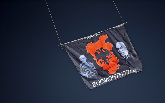 epa04447003 The flag with Albanian symbols flies above the stadium from a remote controlled drone during the Euro 2016 Group I qualifying match between Serbia and Albania which provoked a fight betwee ...