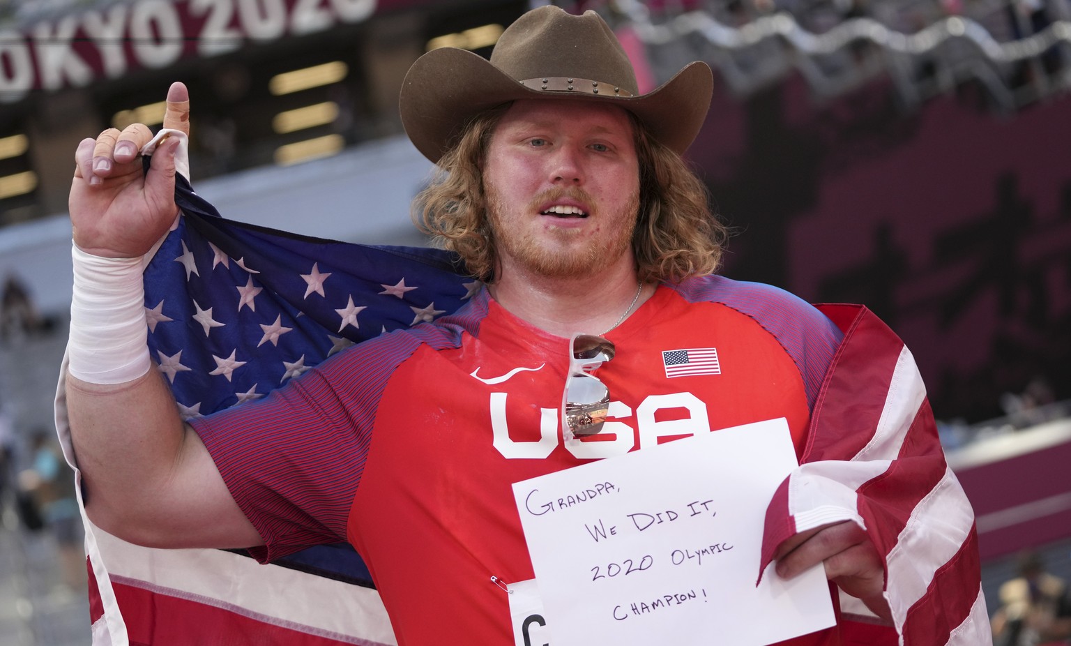 Ryan Crouser, of United States, celebrates after winning the final of the men&#039;s shot put at the 2020 Summer Olympics, Thursday, Aug. 5, 2021, in Tokyo. (AP Photo/Matthias Schrader)