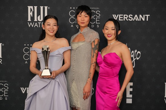 Arden Cho, from left, May Hong and Ji-young Yoo pose with the award for best animated feature for "KPop Demon Hunters" in the press room during the 31st Annual Critics Choice Awards on Sunda ...