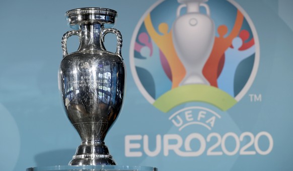 FILE - In this Thursday, Oct. 27, 2016 file photo, the Euro soccer championships trophy is seen in front of the logo during the presentation of Munich&#039;s logo as one of the host cities of the Euro ...