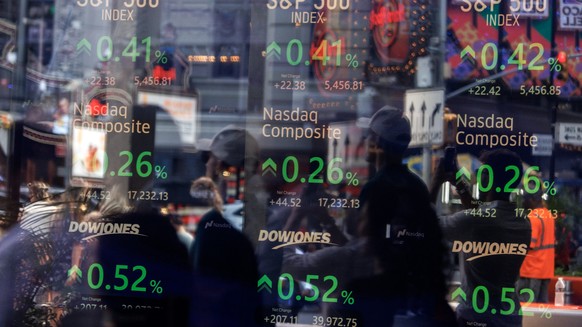 epa11549023 Stock prices are listed on a screen as seen through the window at the Nasdaq MarketSite in New York, New York, USA, 14 August 2024. US stocks, including Dow Jones Industrial Average, went  ...