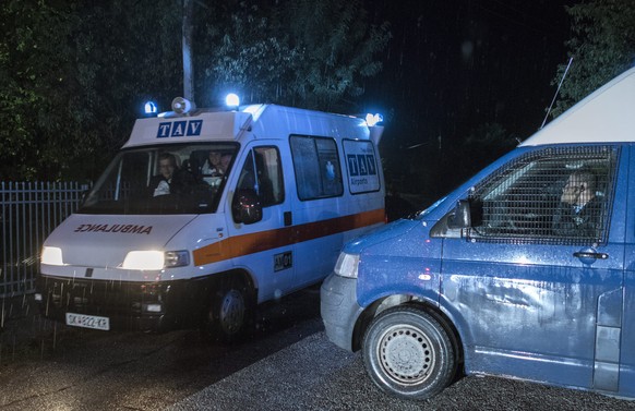 epa05527838 An ambulance passes next to a police van blocking the access road towards the crash area where a small airplane crashed this evening near Kozle village, 10 km south of capitol Skopje, The  ...