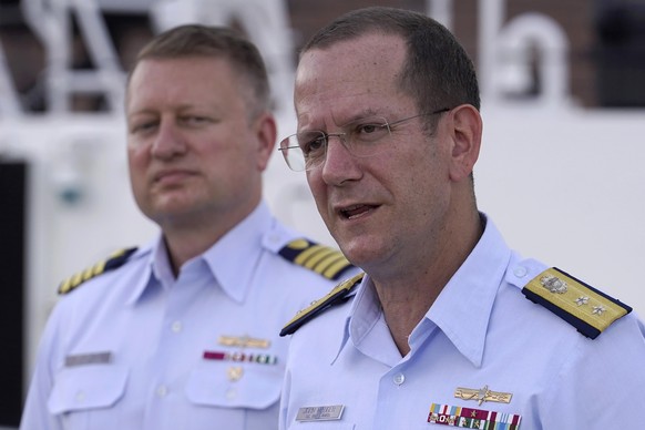 U.S. Coast Guard Rear Adm. John Mauger, commander of the First Coast Guard District, right, speaks to members of the media as Capt. Jason Neubauer, chief investigator, U.S. Coast, left, looks on durin ...
