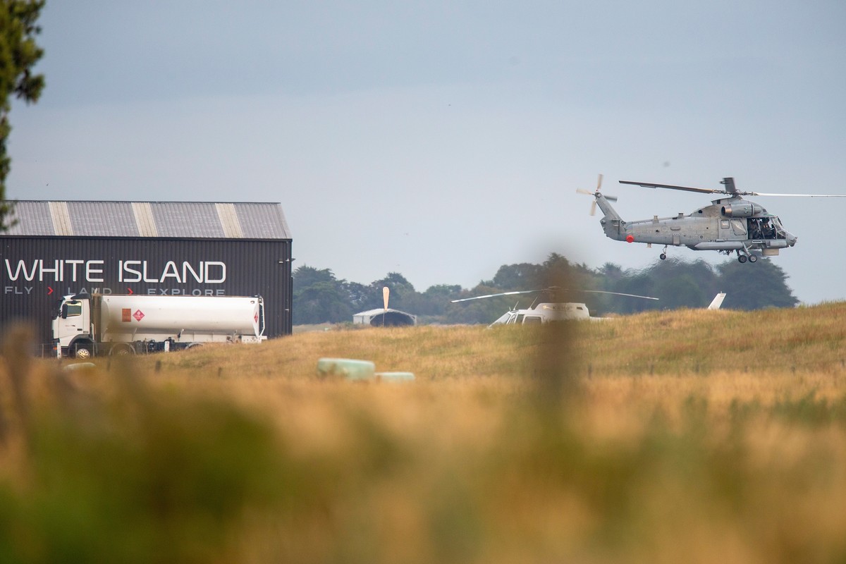 epa08067155 A military helicopter departs Whakatane airport during a recovery operation to retrieve the remaining bodies on White Island following it's eruption on Monday, in Whakatane, New Zeala ...
