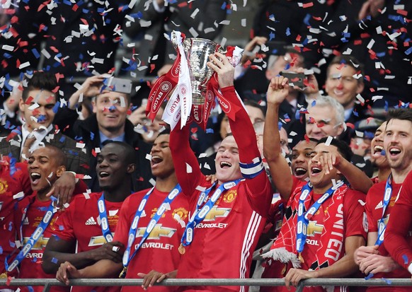 epaselect epa05816934 Manchester United&#039;s Wayne Rooney lifts the League Cup after Man Utd defeated Southampton 3-2 during the EFL Cup final at Wembley Stadium in London, Britain, 26 February 2017 ...