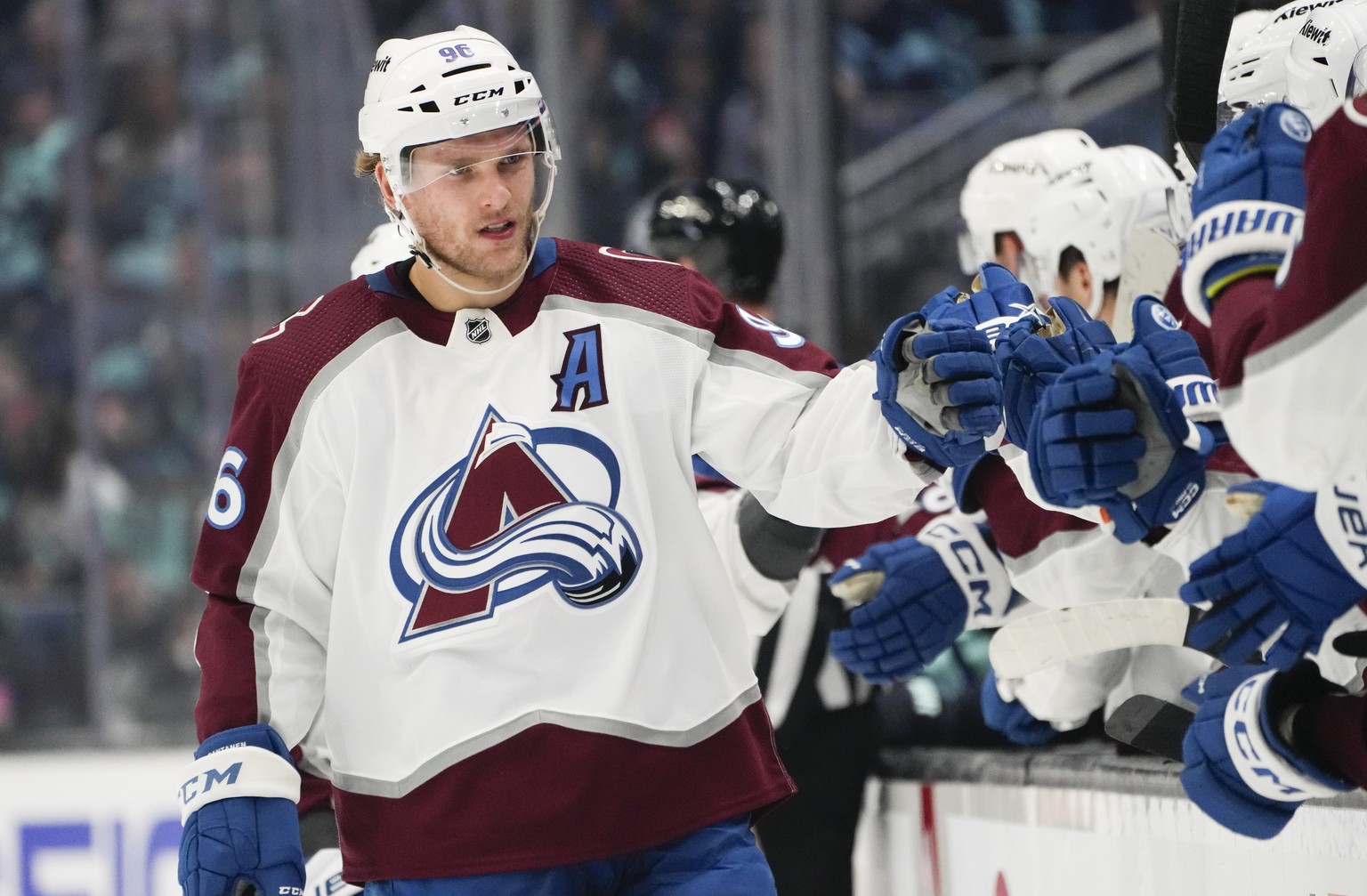 Colorado Avalanche right wing Mikko Rantanen (96) is greeted by the bench after his goal against the Seattle Kraken during the first period of Game 6 of an NHL hockey Stanley Cup first-round playoff s ...