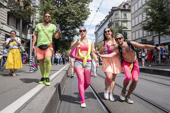 epa06942686 Ravers party during the Street Parade in Zurich, Switzerland 11 August 2018. Hundreds of thousands of participants dancing through the streets during the 27th Street Parade, an annual danc ...
