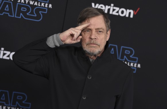 FILE - Mark Hamill salutes as he arrives at the world premiere of "Star Wars: The Rise of Skywalker" in Los Angeles on Dec. 16, 2019. When air raid alarms sound in Ukraine, they also trigger ...