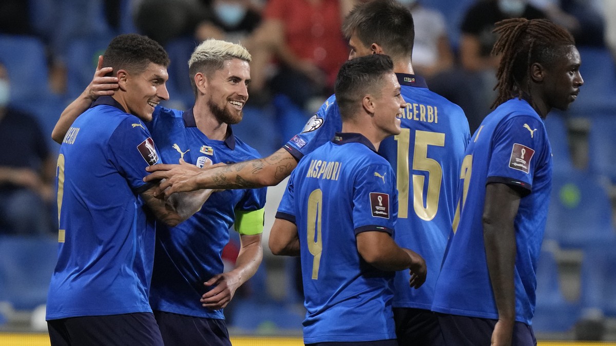 Italy's Giovanni Di Lorenzo, left, celebrates with bis teammates after scoring his side's fifth goal during the World Cup 2022 qualifier group C soccer match between Italy and Lithuania at t ...