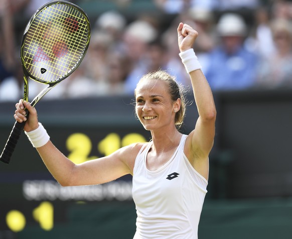 epa06070670 Magdalena Rybarikova of Slovakia celebrates a point against Karolina Pliskova of the Czech Republic in their second round match during the Wimbledon Championships at the All England Lawn T ...