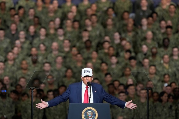 U.S. President Donald Trump speaks to the members of the military aboard the USS George Washington at the U.S. Navy&#039;s Yokosuka base in Yokosuka, south of Tokyo, Tuesday, Oct. 28, 2025. (AP Photo/ ...
