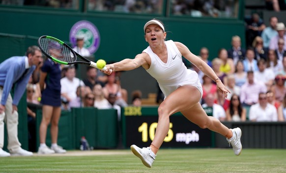 epa07714403 Simona Halep of Romania in action against Serena Williams of the USA during their final match for the Wimbledon Championships at the All England Lawn Tennis Club, in London, Britain, 13 Ju ...