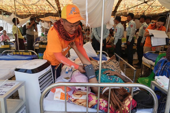 A Bhutanese medical volunteer attends to a patient at a make-shift tent after last week&#039;s earthquake in Naypyitaw, Myanmar, Friday, April 4, 2025. (AP Photo)
Myanmar Earthquake