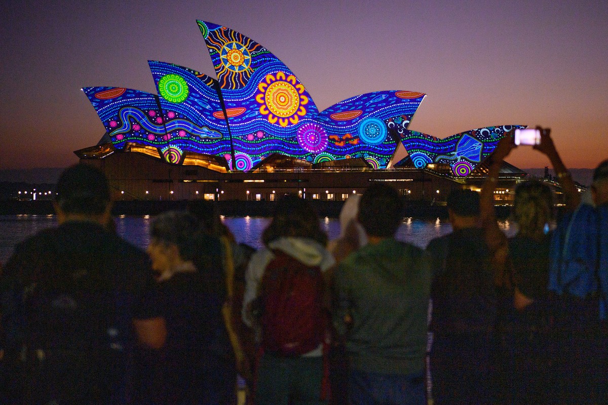 epa10429619 Kamilaroi artist Rhonda Sampson's 'Diyan Warrane' artwork is projected onto the sails of the Sydney Opera House at dawn during Australia Day 2023 celebrations in Sydney, Aus ...