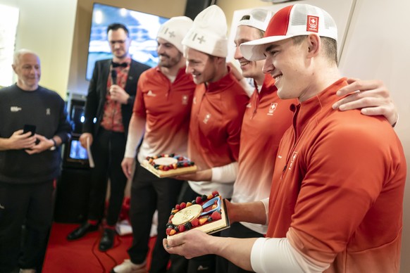 Silver medalist Switzerland's Loic Meillard, silver medalist Switzerland's Marco Odermatt, gold medalist Switzerland's Tanguy Nef and gold medalist Switzerland's Franjo von Allmen, ...