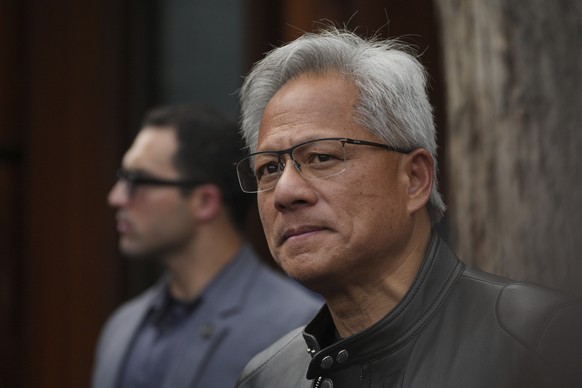 CEO of Nvidia Jensen Huang pauses during a press conference at the Mandarin Oriental Qianmen after attending the third China International Supply Chain Expo, in Beijing, Wednesday, July 16, 2025. (AP  ...