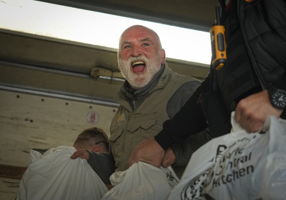 FILE - Jose Andres, a Spanish chef, and founder of World Central Kitchen unloads the humanitarian food packages delivered with WCK&#039;s truck in Kherson, Ukraine, on Nov. 15, 2022. World Central Kit ...