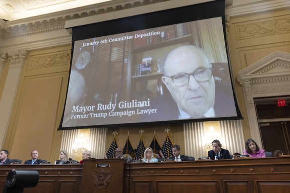 epa10011077 Former Trump campaign lawyer Rudy Giuliani is seen on a monitor during a hearing of the House Select Committee to Investigate the January 6th Attack on the US Capitol, on Capitol Hill in W ...