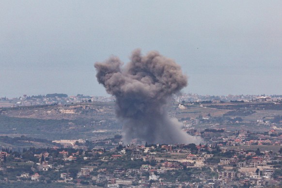 epa12950477 Smoke rises as a result of an Israeli strike on a south Lebanon village, as seen from the upper Galilee on the Israel-Lebanon border, 12 May 2026. EPA/ATEF SAFADI