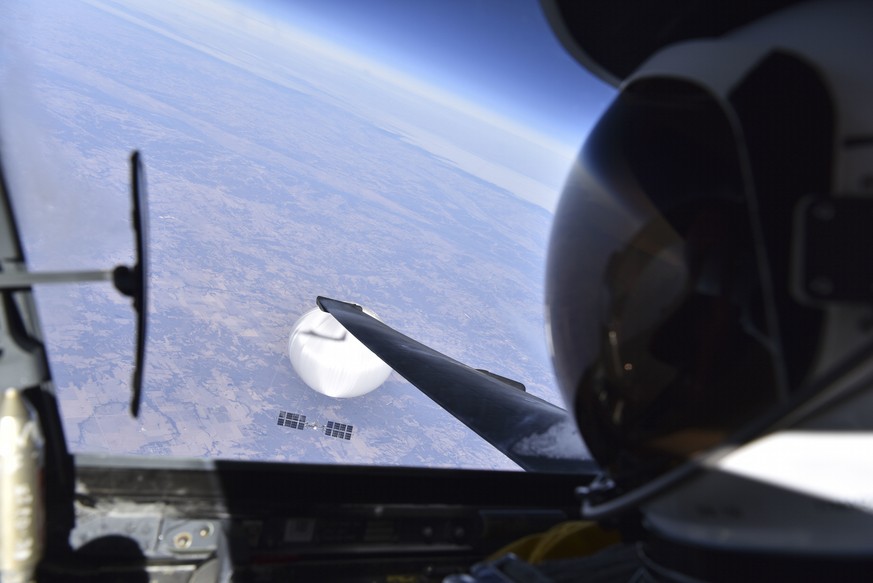 In this image released by the Department of Defense on Wednesday, Feb. 22, 2023, a U.S. Air Force U-2 pilot looks down at a suspected Chinese surveillance balloon as it hovers over the United States o ...