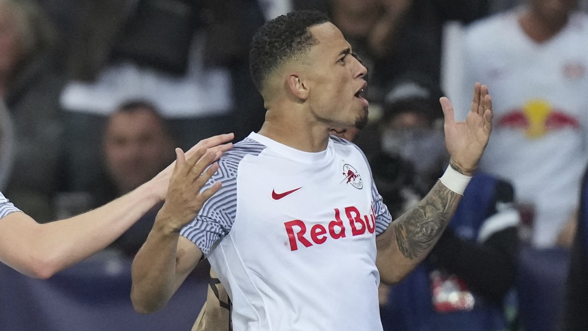 Salzburg's Noah Okafor celebrates after scoring his side's third goal during the Champions League group G soccer match between Salzburg and VfL Wolfsburg, at the Salzburg stadium, in Salzbur ...