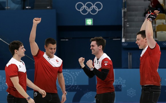 Switzerland&#039;s team celebrate as they win the bronze medal after defeating Canada during the men&#039;s curling match at the 2018 Winter Olympics in Gangneung, South Korea, Friday, Feb. 23, 2018.  ...