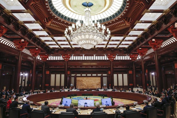 epa05965262 Attendees meet during the Roundtable Summit Phase One Sessions of Belt and Road Forum at the International Conference Center in Yanqi Lake, north of Beijing, China, 15 May 2017. The Belt a ...