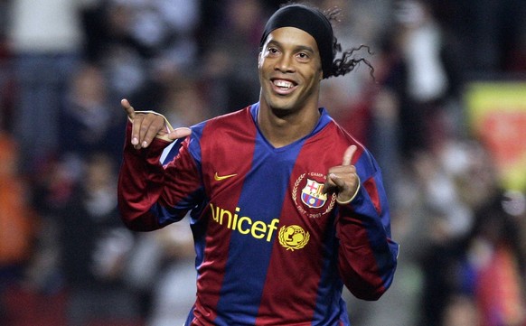 FILE - In this Dec. 9, 2007 file photo, FC Barcelona player Ronaldinho, from Brazil, celebrates his goal against Deportivo Coruna during his Spanish league soccer match at the Camp Nou Stadium in Barc ...
