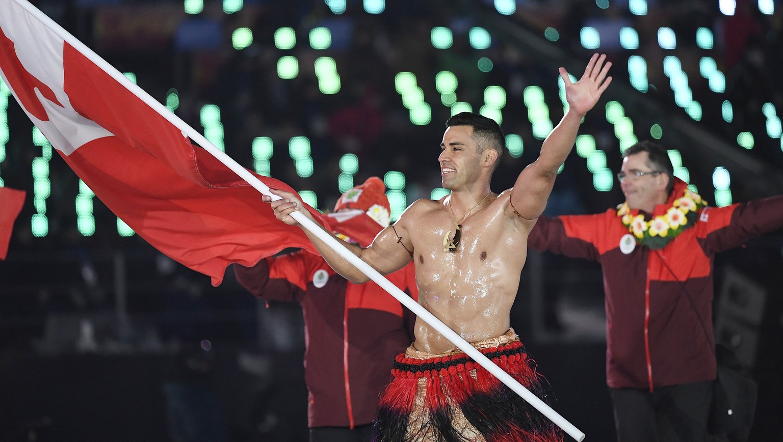 epa06508524 Team Tonga with flag bearer Pita Taufatofua arrive at the Opening Ceremony of the PyeongChang 2018 Olympic Games at the Olympic Stadium, Pyeongchang county, South Korea, 09 February 2018.  ...