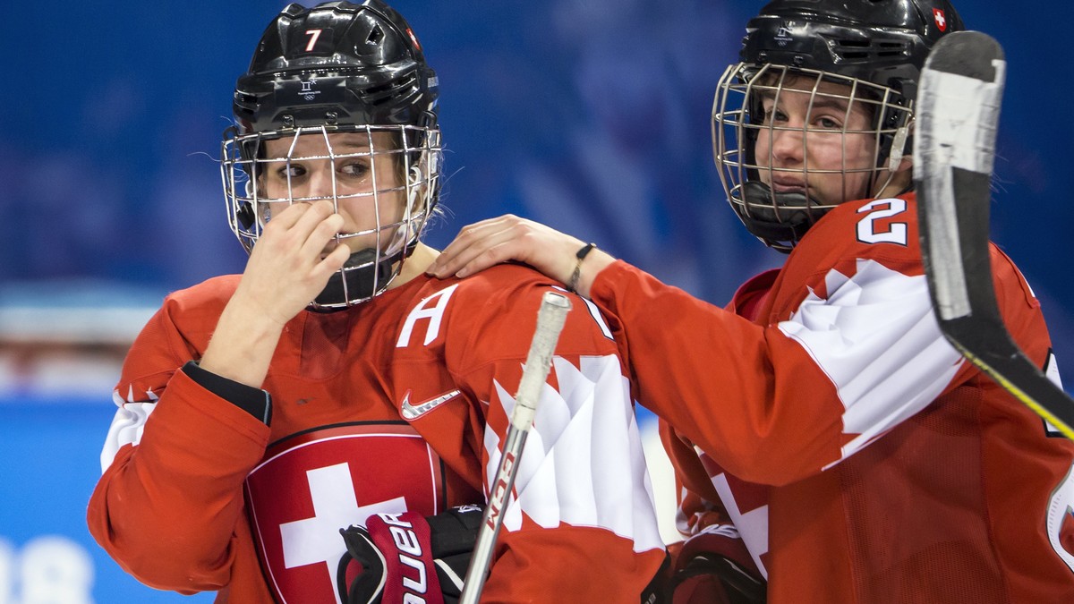 epa06535101 Lara Stalder of Switzerland, and Alina Muller of Switzerland, from left, react after the women's Ice Hockey quarterfinal match between Olympic Athletes from Russia and Switzerland at  ...