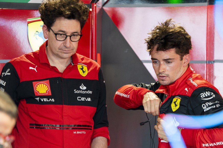epa09930679 Monaco&#039;s Formula One driver Charles Leclerc of Scuderia Ferrari talks with Scuderia Ferrari team principal Mattia Binotto following Free Practice 1 of the Formula One Grand Prix of Mi ...
