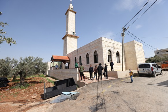 epa12813665 Palestinians inspect the Mohammed Fayyad Mosque after an attack by Israeli settlers in Duma village, near the West Bank city of Nablus, 12 March 2026. According to the Palestinian news age ...